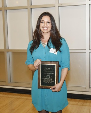 A person holding a plaque